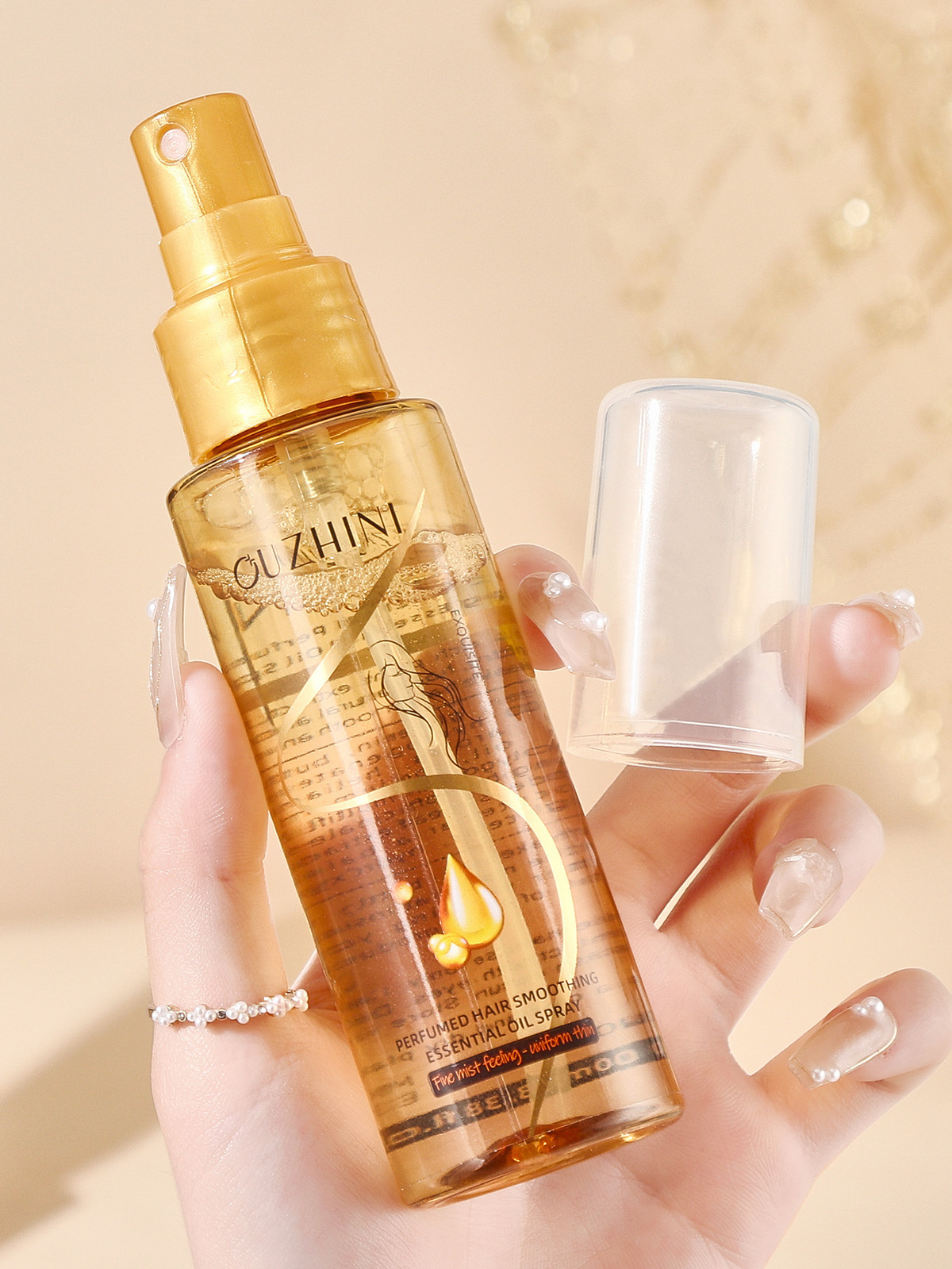 Wholesale Ouzhini Perfume Softening Hair Care Essential Oil Spray